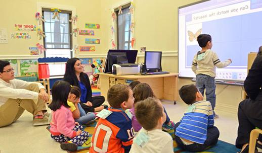 Child working on smart board